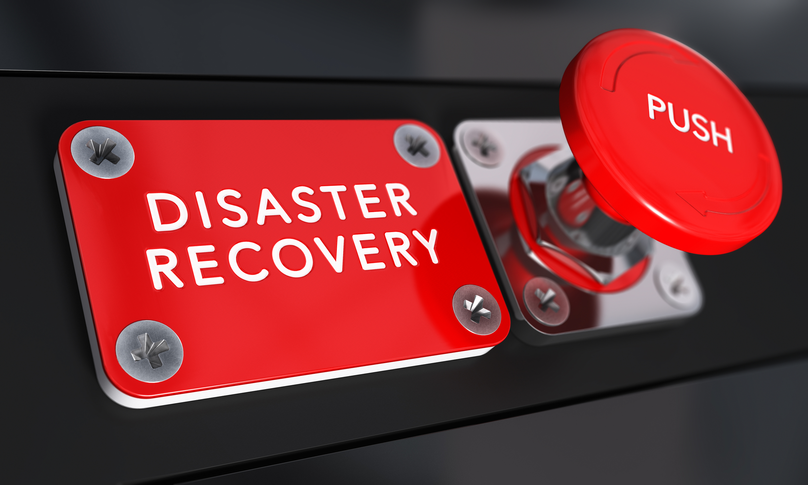 Close up on a red panic button with the text Distaster Recovery with blur effect. Concept image for illustration of DRP business continuity and crisis communication.